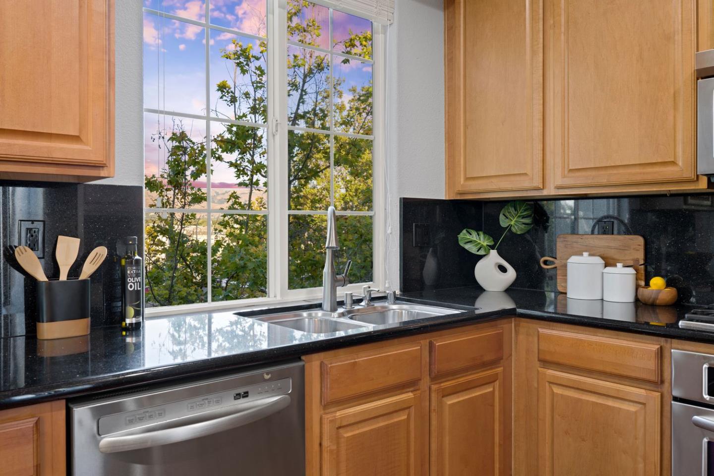 600 Mente Linda Loop Milpitas, CA 95035 - Photo 13 of 29 a kitchen with stainless steel appliances granite countertop a sink and cabinets