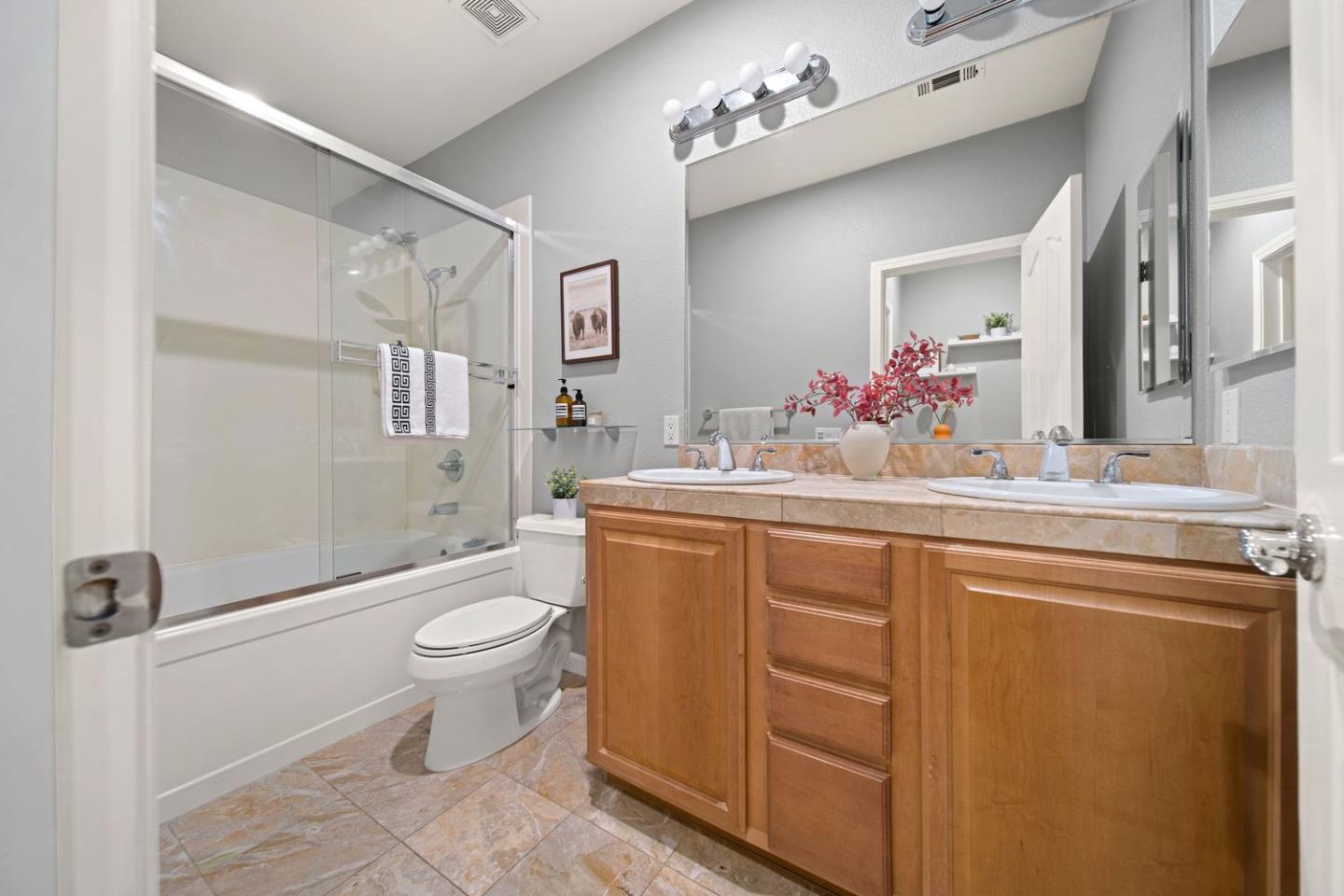 600 Mente Linda Loop Milpitas, CA 95035 - Photo 19 of 29 a bathroom with a sink vanity mirror and toilet