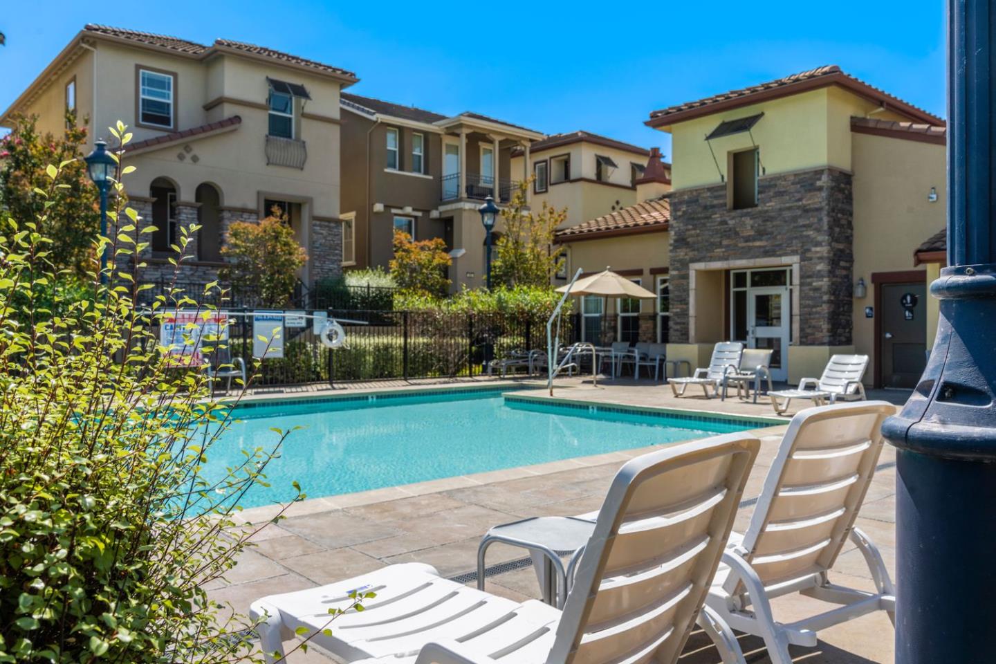 600 Mente Linda Loop Milpitas, CA 95035 - Photo 23 of 29 a front view of a house with swimming pool having outdoor seating