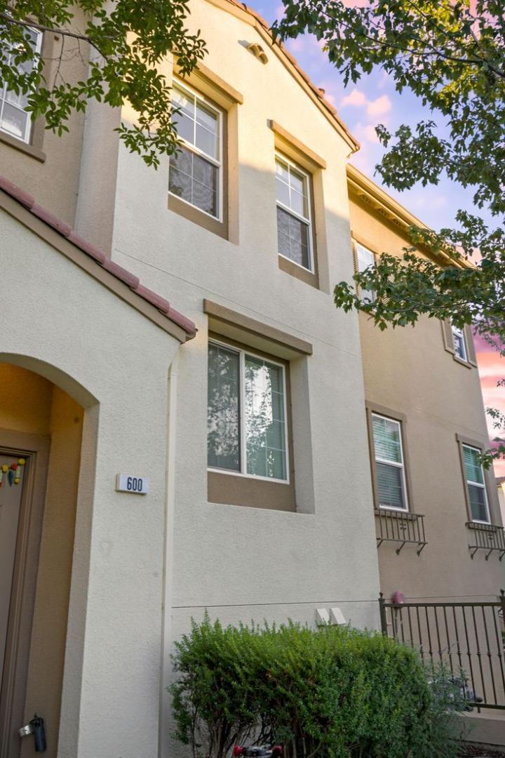 600 Mente Linda Loop Milpitas, CA 95035 - Photo 3 of 29 a front view of a house with a yard