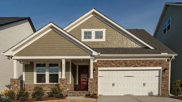 a front view of a house with garage