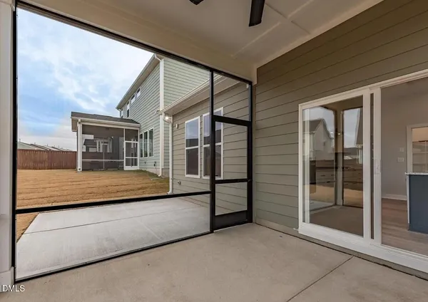 a view of staircase with white walls and a window