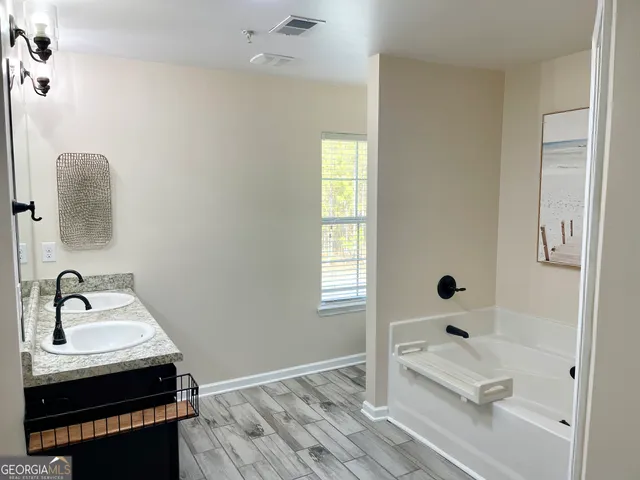a bathroom with a sink and a bathtub