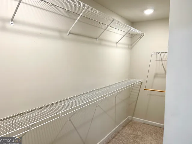 a view of a room with racks on the wall