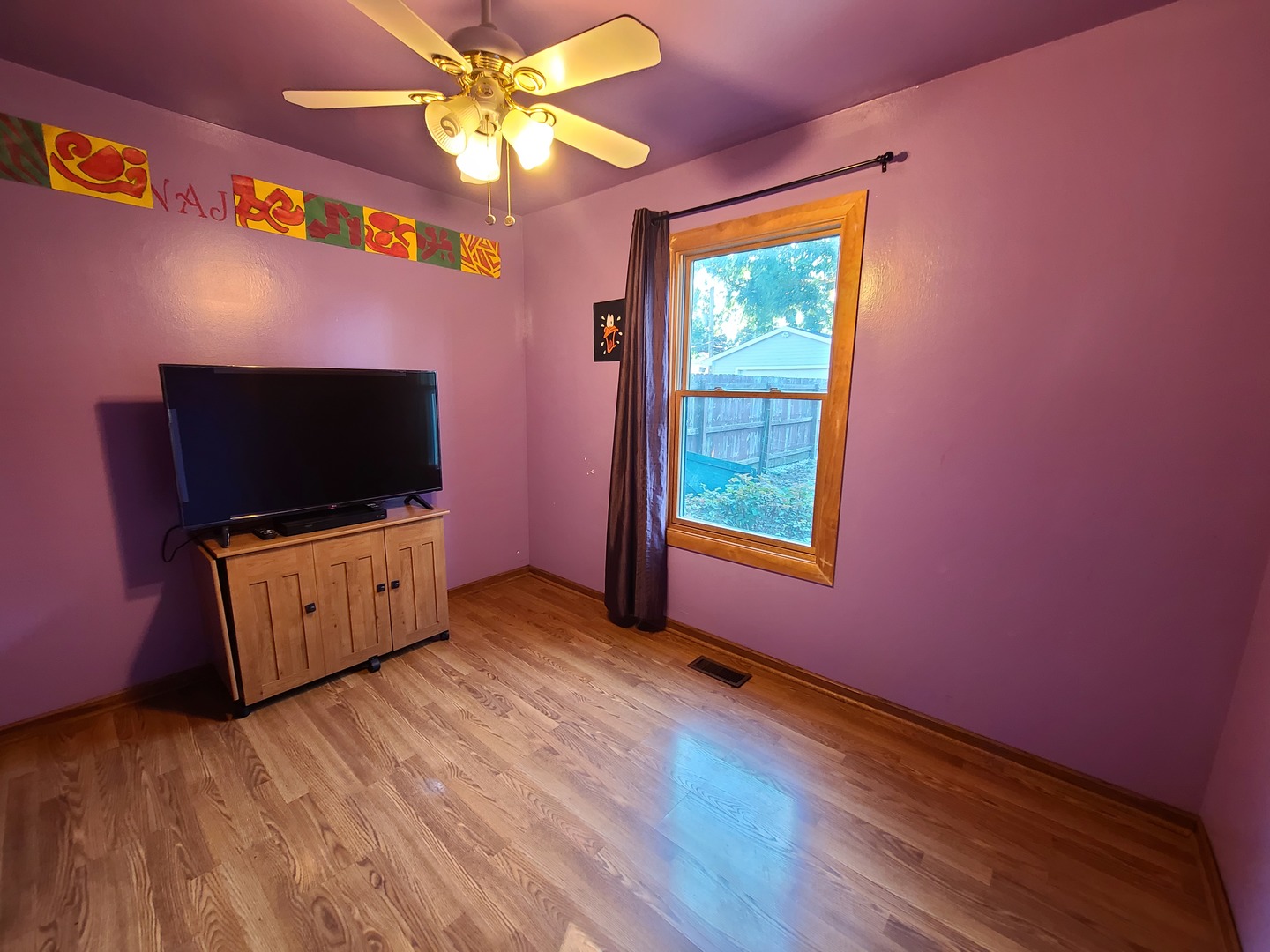 419 Foster Road Wauconda, IL 60084 - Photo 11 of 32 a living room with furniture and a flat screen tv