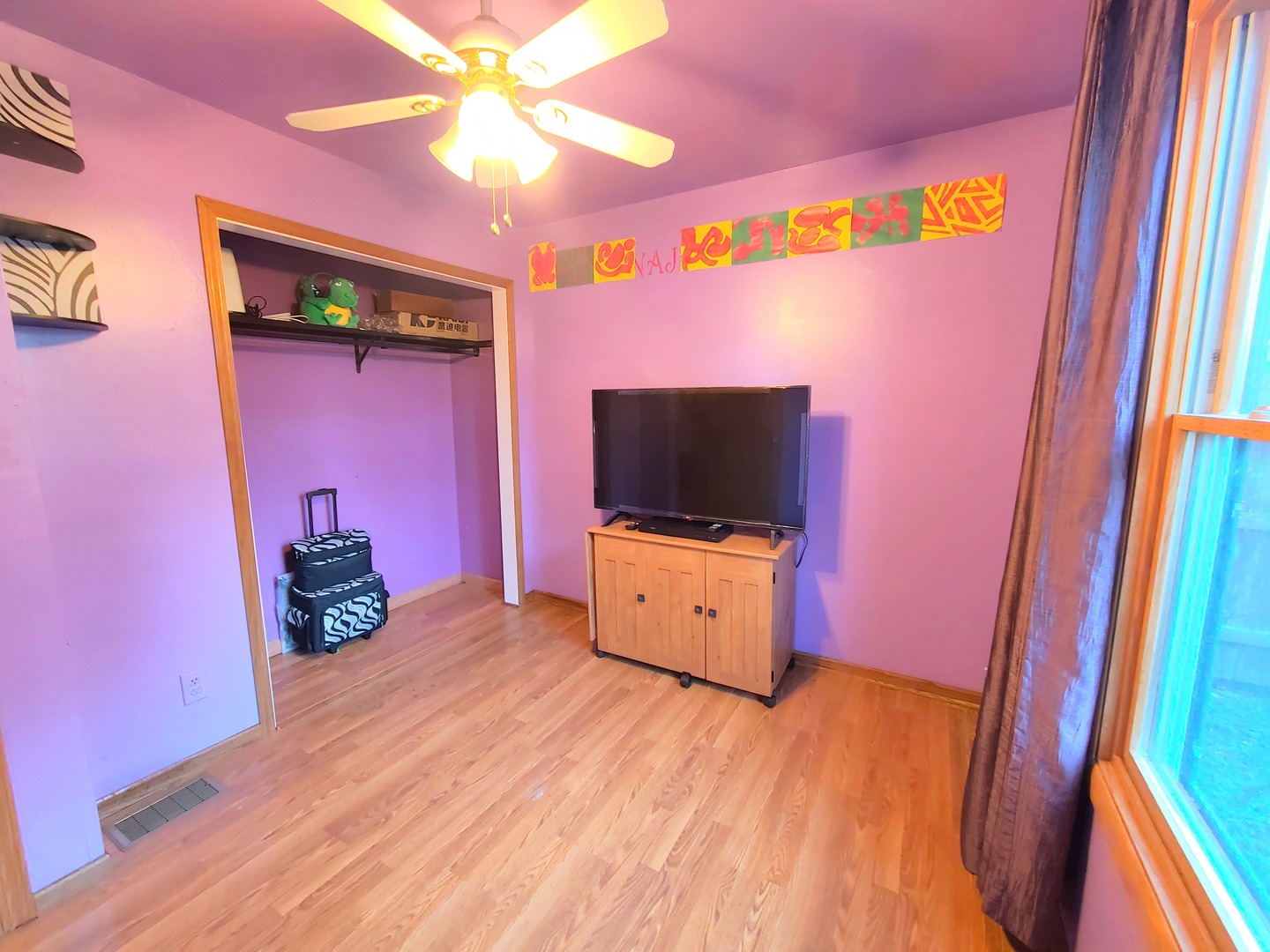 419 Foster Road Wauconda, IL 60084 - Photo 12 of 32 a bedroom with furniture and a flat screen tv