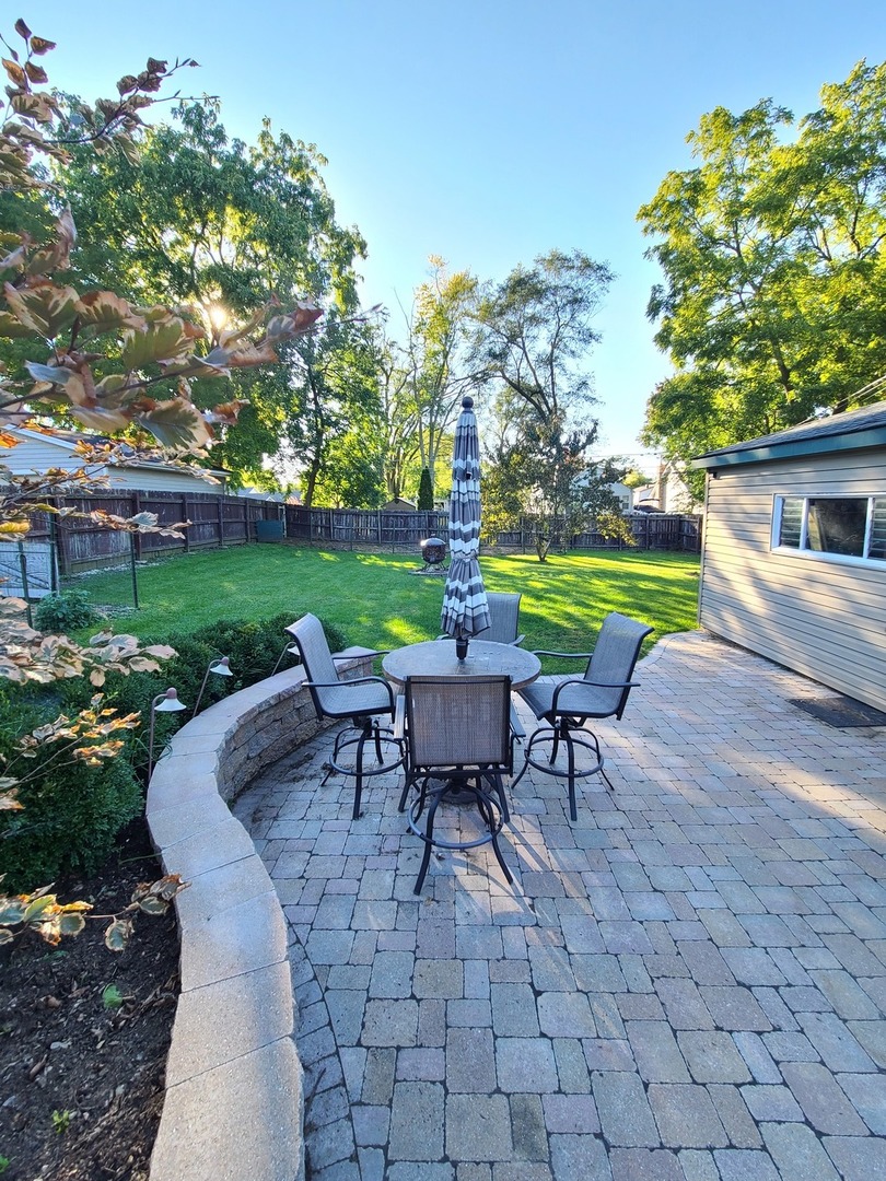419 Foster Road Wauconda, IL 60084 - Photo 17 of 32 a view of a table and chairs in the garden