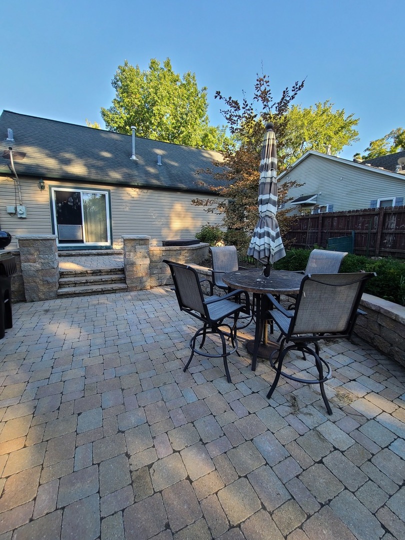 419 Foster Road Wauconda, IL 60084 - Photo 19 of 32 a view of a backyard with furniture and a patio