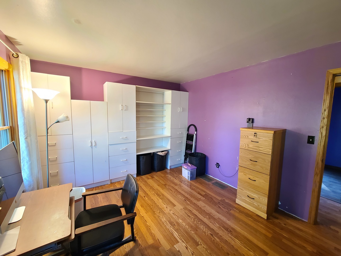 419 Foster Road Wauconda, IL 60084 - Photo 23 of 32 a bed room with a bed and wooden floor