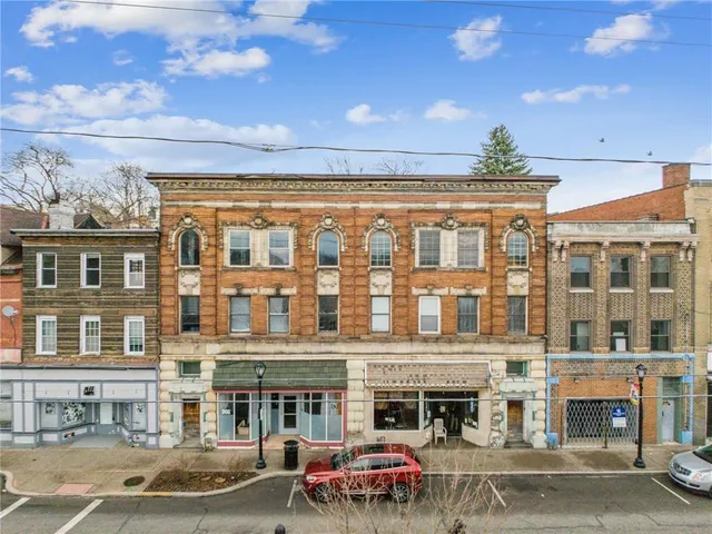 a front view of a building with street view