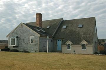 Undisclosed Address Osterville, MA 02655 - Photo 11 of 13 a front view of a house with a yard