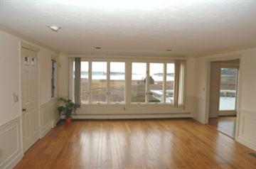 Undisclosed Address Osterville, MA 02655 - Photo 5 of 13 wooden floor in an empty room with a window