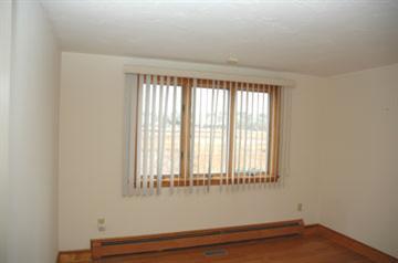 Undisclosed Address Osterville, MA 02655 - Photo 8 of 13 a view of an empty room with wooden floor and a window
