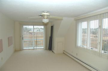 Undisclosed Address Osterville, MA 02655 - Photo 9 of 13 a view of an empty room with a window