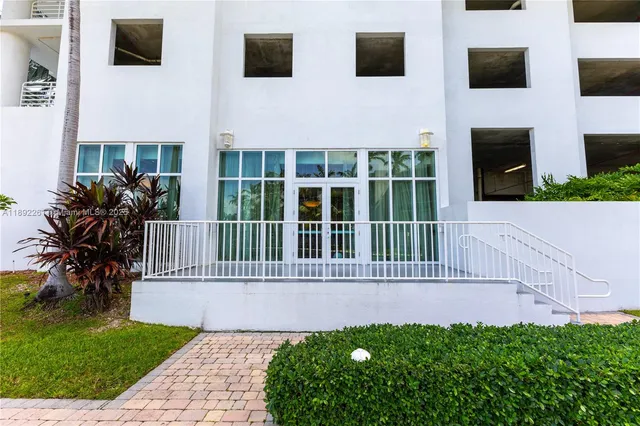 a view of a livingroom with furniture and a flat screen tv