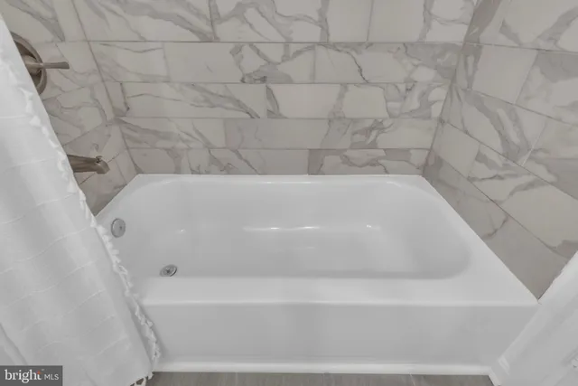 a bathroom with a bathtub