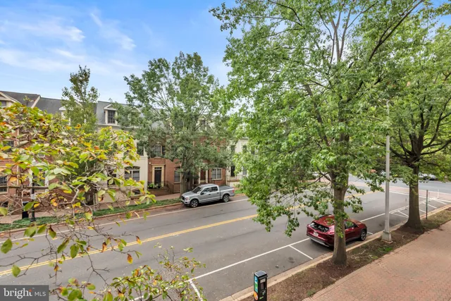 a view of street with parked cars