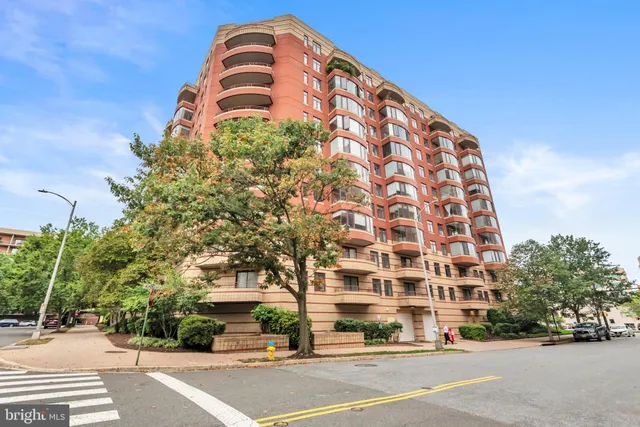 a tall building sitting next to a road