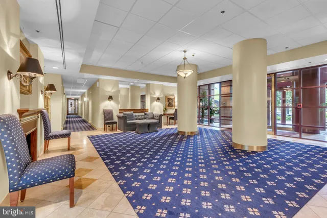 a large room with lots of furniture and wooden floor