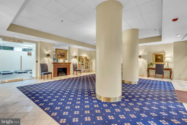 a view of a living room and kitchen with furniture