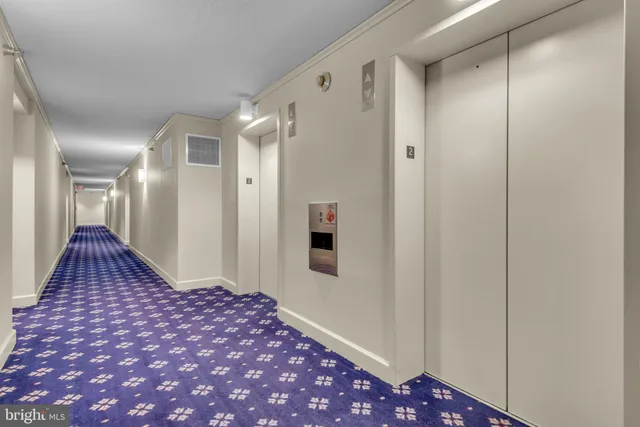 a bedroom with a bed and a mirror