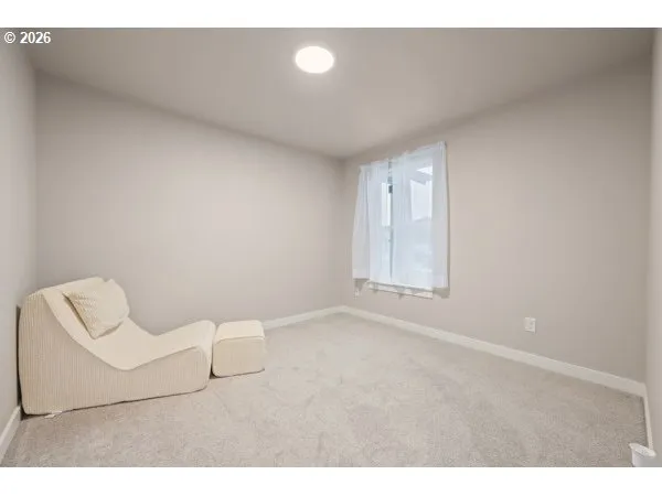 a view of an empty room and a window