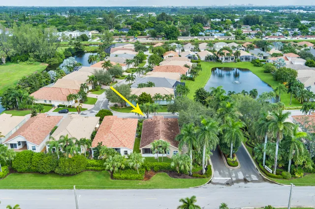 an aerial view of residential houses with outdoor space and street view
