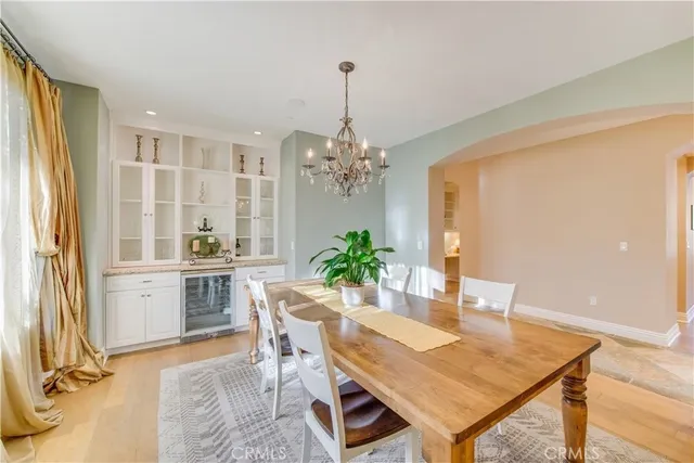 a large kitchen with a table and chairs