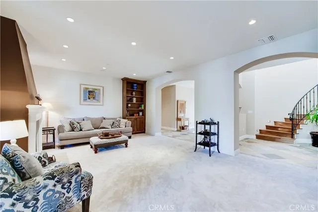 a spacious bedroom with a bed and a window