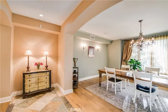 a view of a dining room with furniture and window