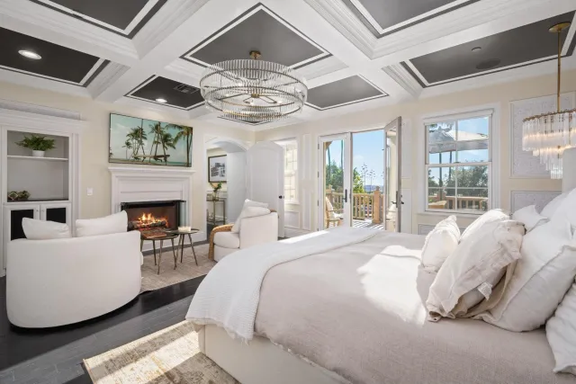 a spacious bedroom with a bed and a large window