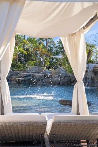 a view of a lake with a bench in front of it
