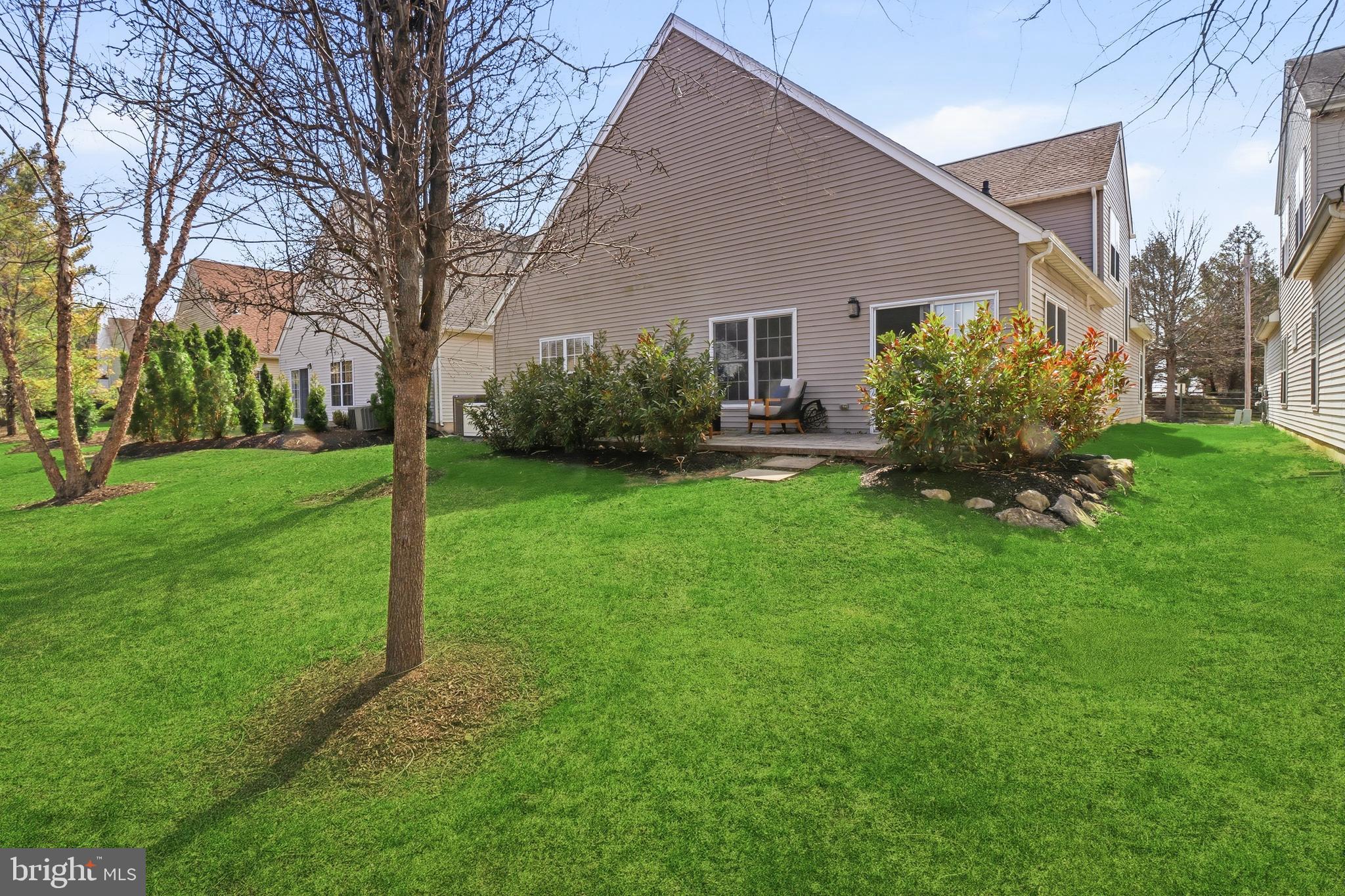 12 Cardinal Flower Lane Princeton Junction, NJ 08550 - Photo 13 of 62 a view of a house with backyard and a garden