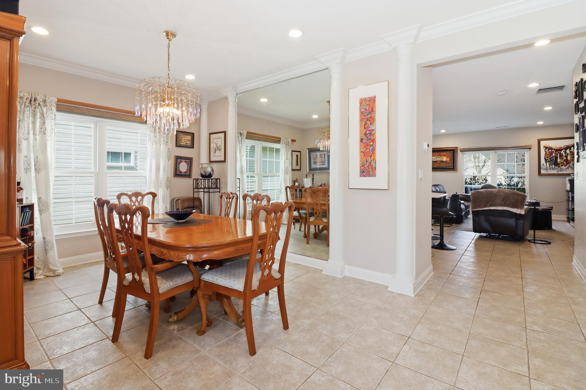 12 Cardinal Flower Lane Princeton Junction, NJ 08550 - Photo 24 of 62 a view of a dining room with furniture and a chandelier