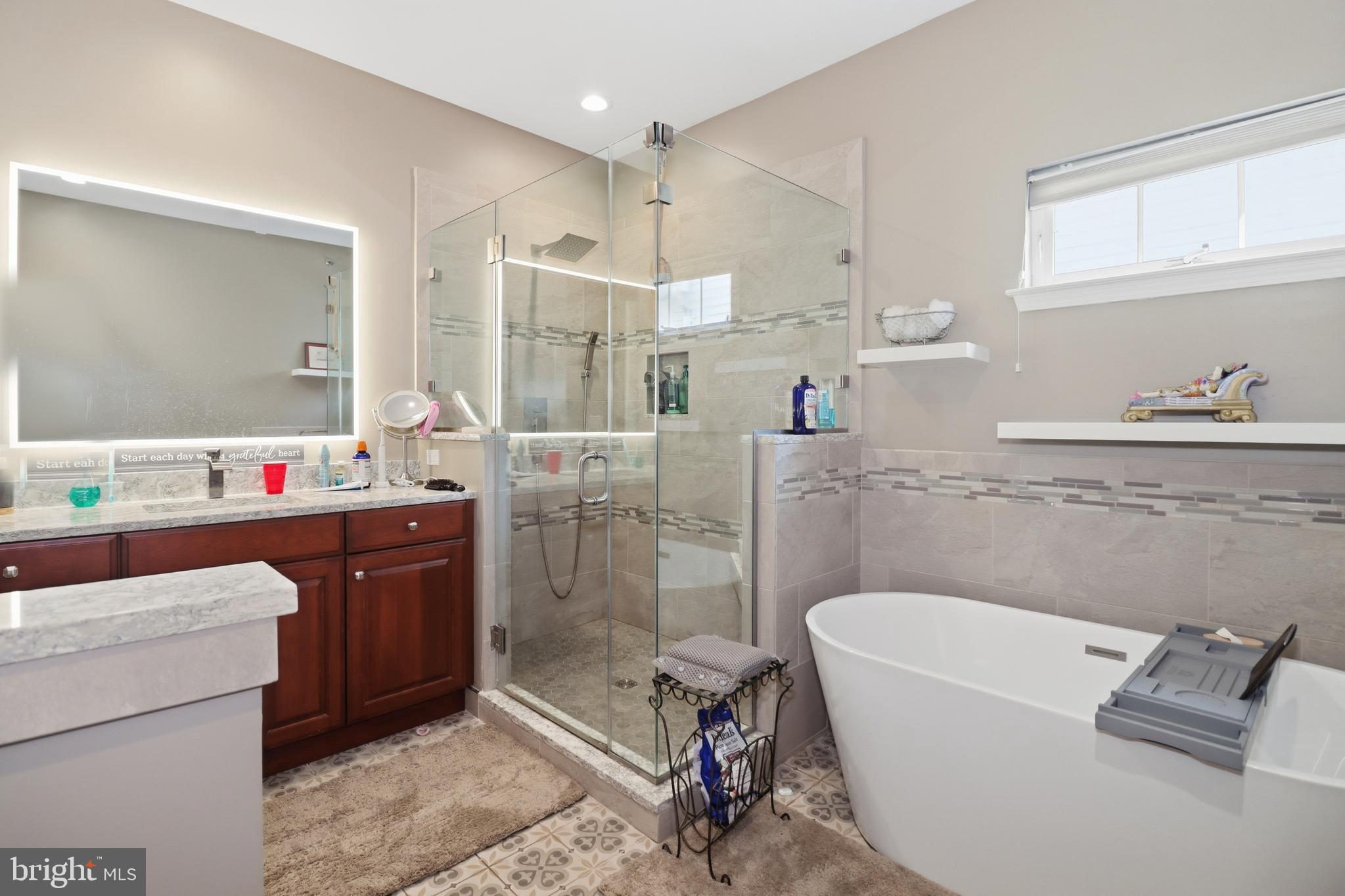 12 Cardinal Flower Lane Princeton Junction, NJ 08550 - Photo 29 of 62 a bathroom with a tub sink and mirror