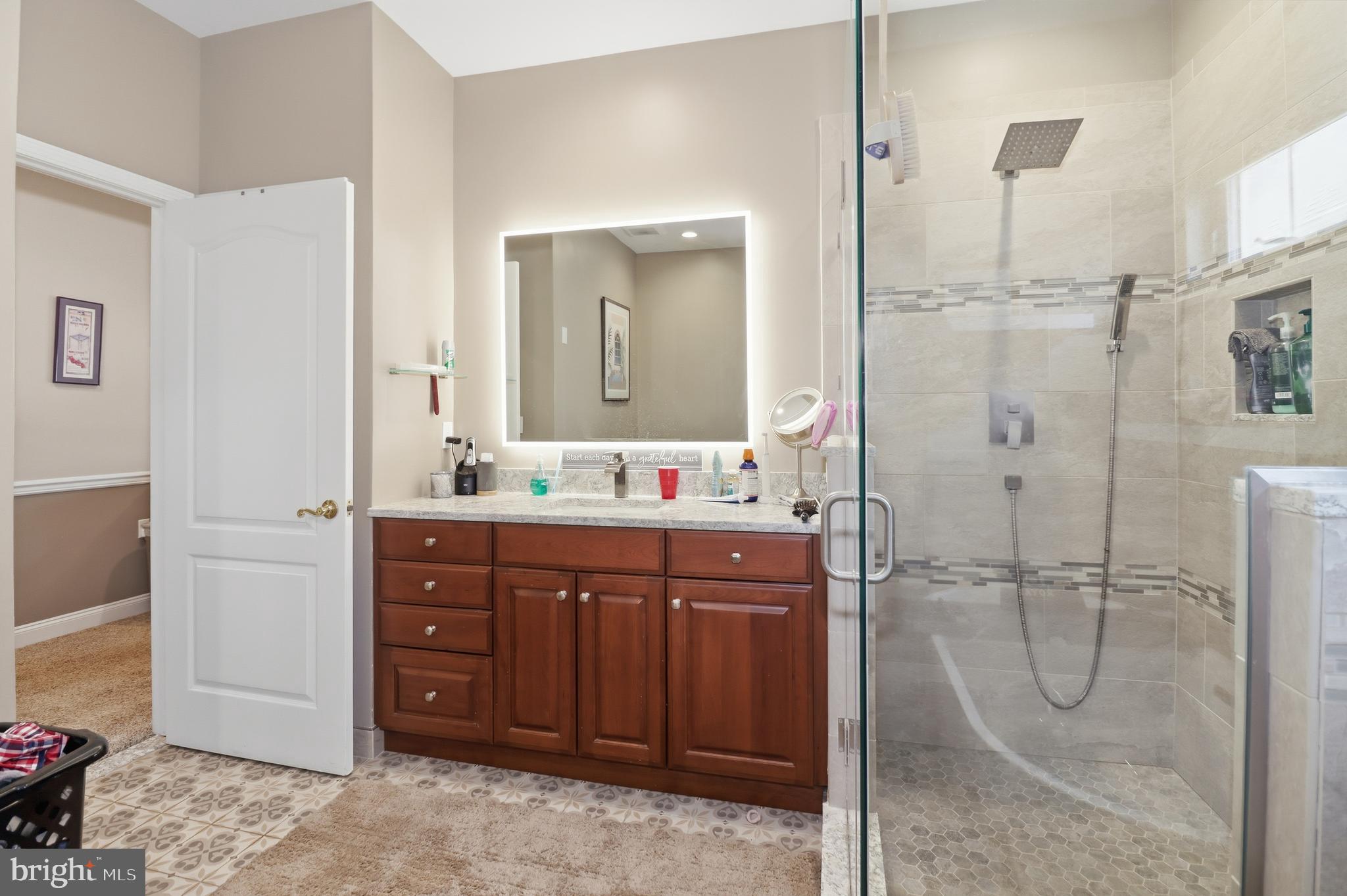 12 Cardinal Flower Lane Princeton Junction, NJ 08550 - Photo 31 of 62 a bathroom with a double vanity sink mirror and shower