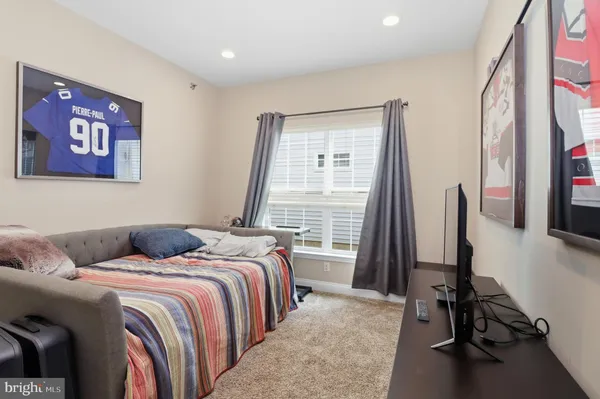 a view of a livingroom with furniture and a window