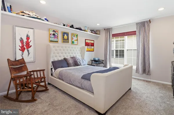 a balcony with furniture and a potted plant