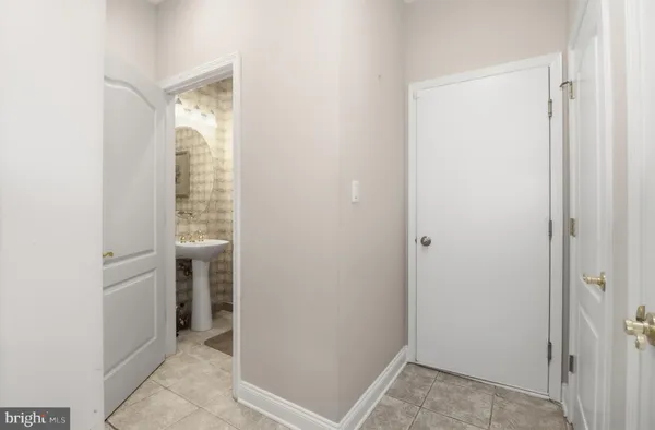 a living room with fireplace furniture and a large window