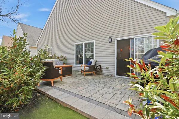 a large kitchen with stainless steel appliances a counter space a sink and a refrigerator