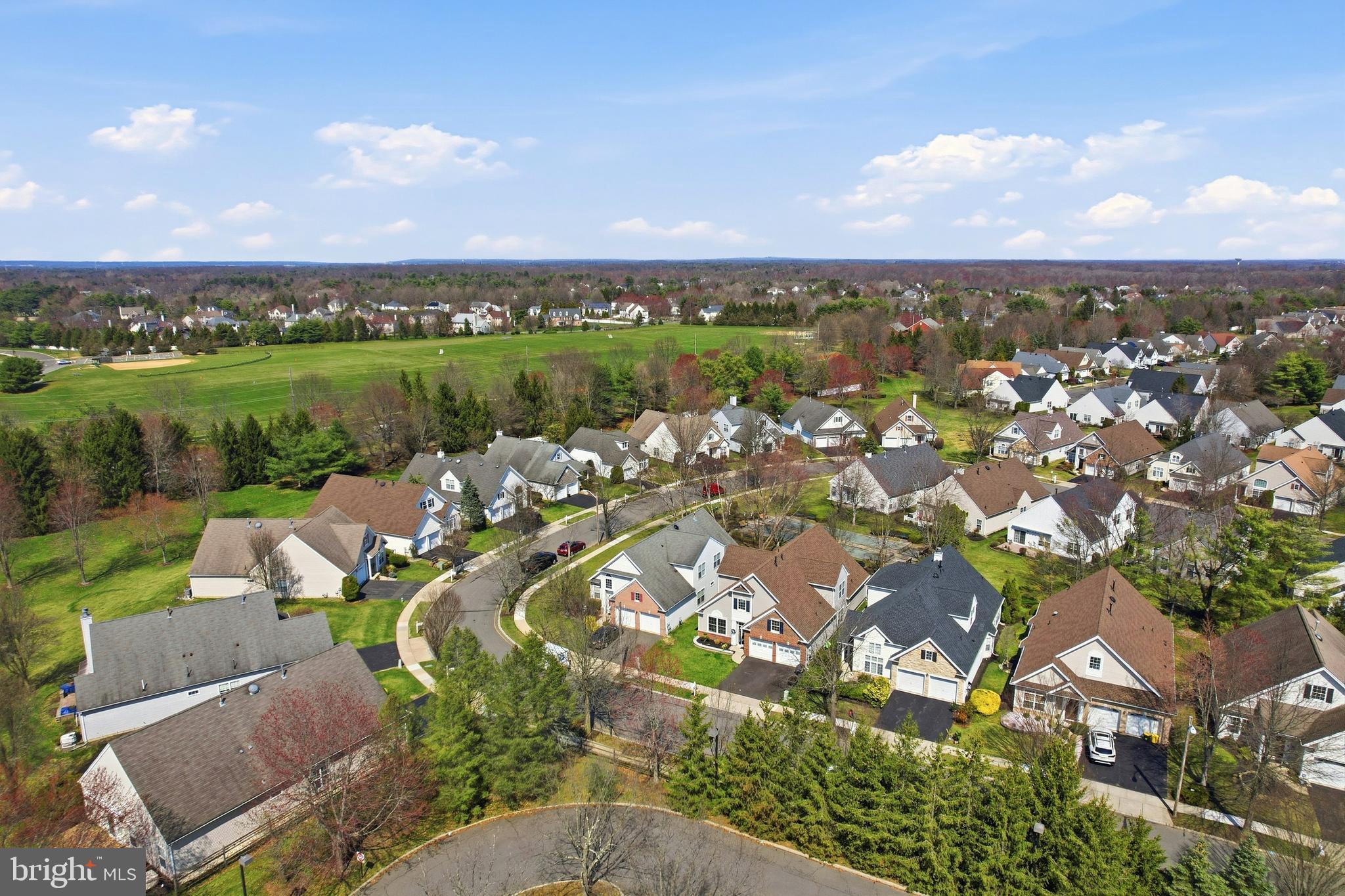 12 Cardinal Flower Lane Princeton Junction, NJ 08550 - Photo 7 of 62 an aerial view of a city with lots of residential buildings lake and ocean view