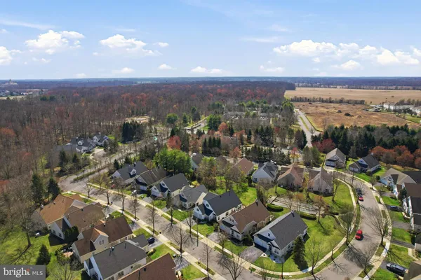 an aerial view of a house with a swimming pool