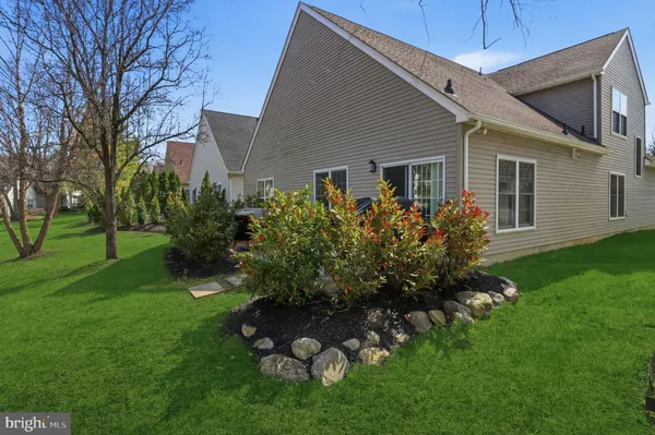a view of a patio with couches and potted plants