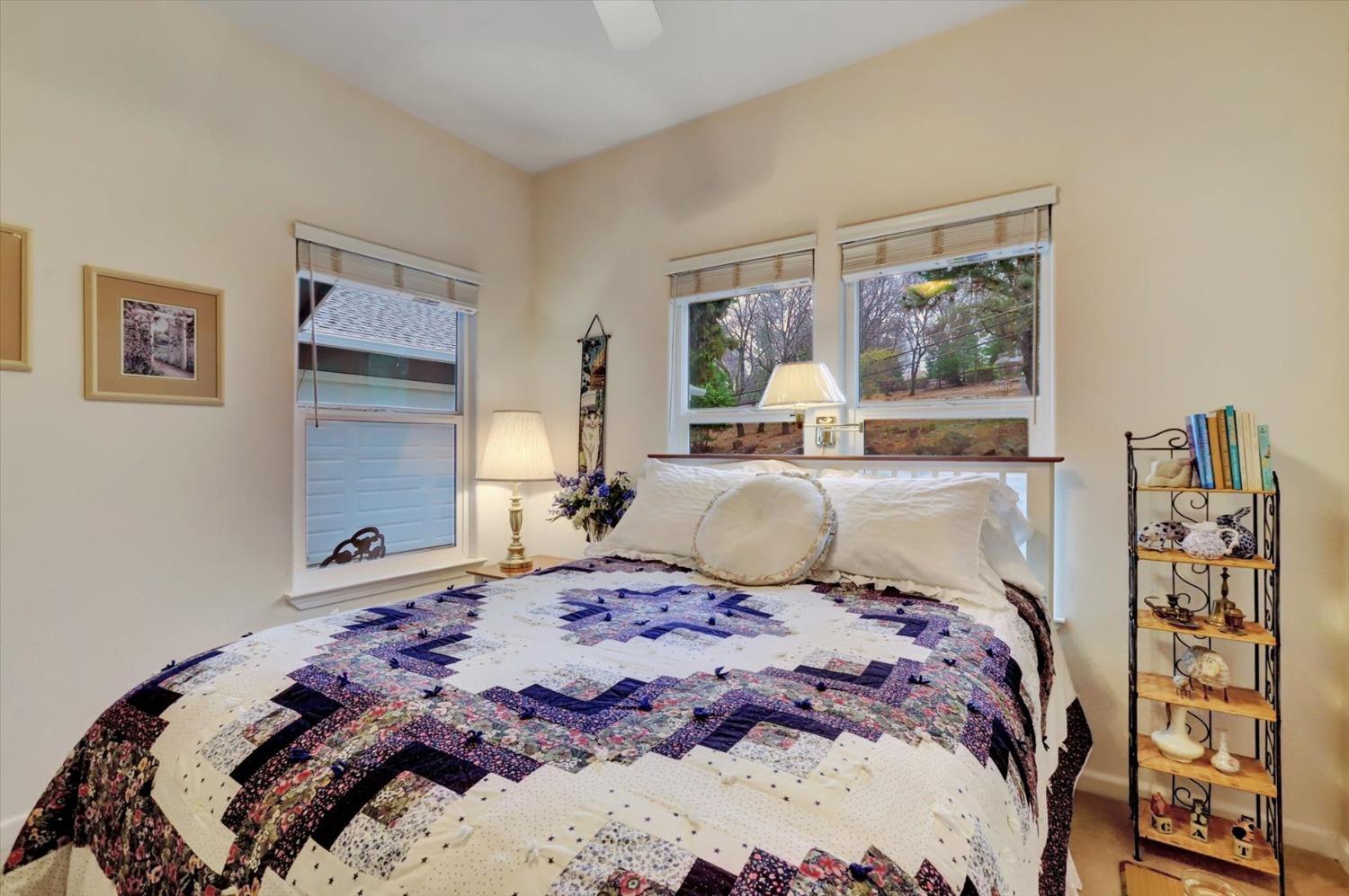 17036 Alice Way Grass Valley, CA 95949 - Photo 27 of 58 a bedroom with a large bed and a window
