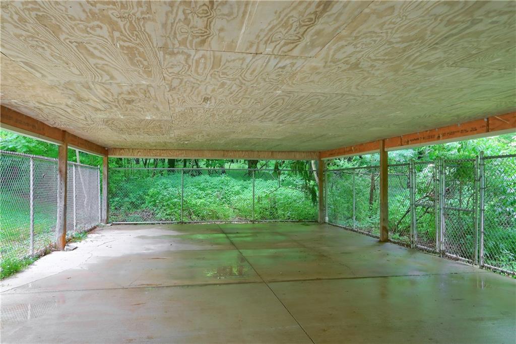169 North Stone Base Road Mercer, PA 16137 - Photo 22 of 23 Covered and Fenced patio inside with access to additional fenced runs