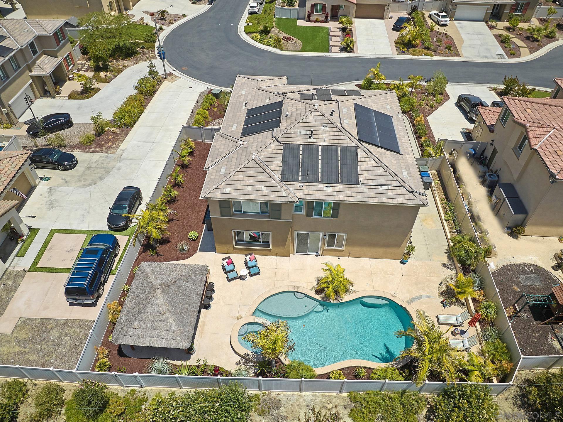 an aerial view of a house with swimming pool