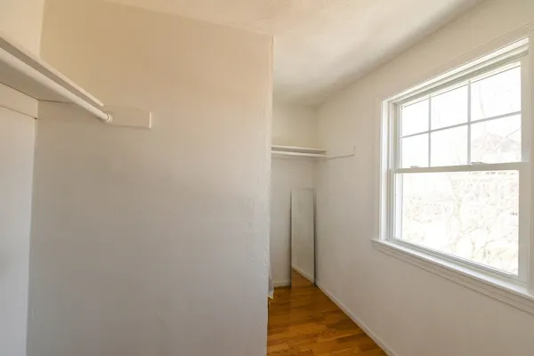 a view of a hallway with a window