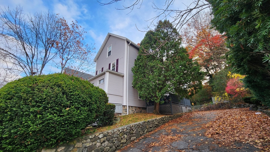 a view of a house with a tree