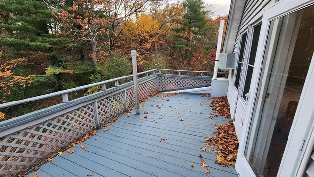 a view of balcony with wooden floor