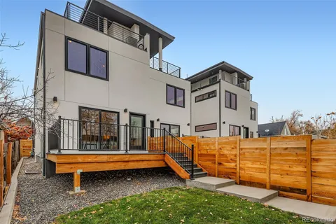 a blue bench sitting in front of a building